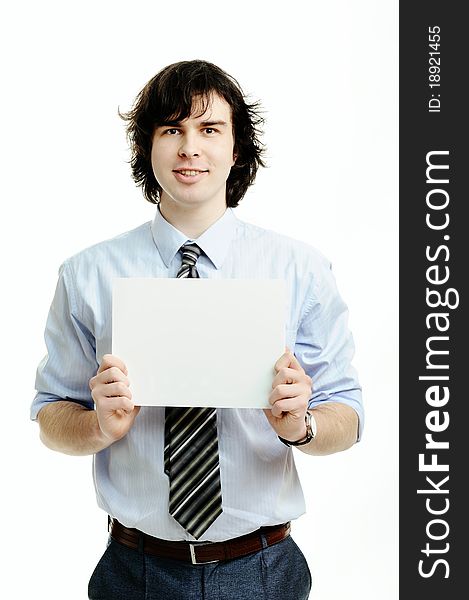 A young handsome man showing a sheet of paper. A young handsome man showing a sheet of paper