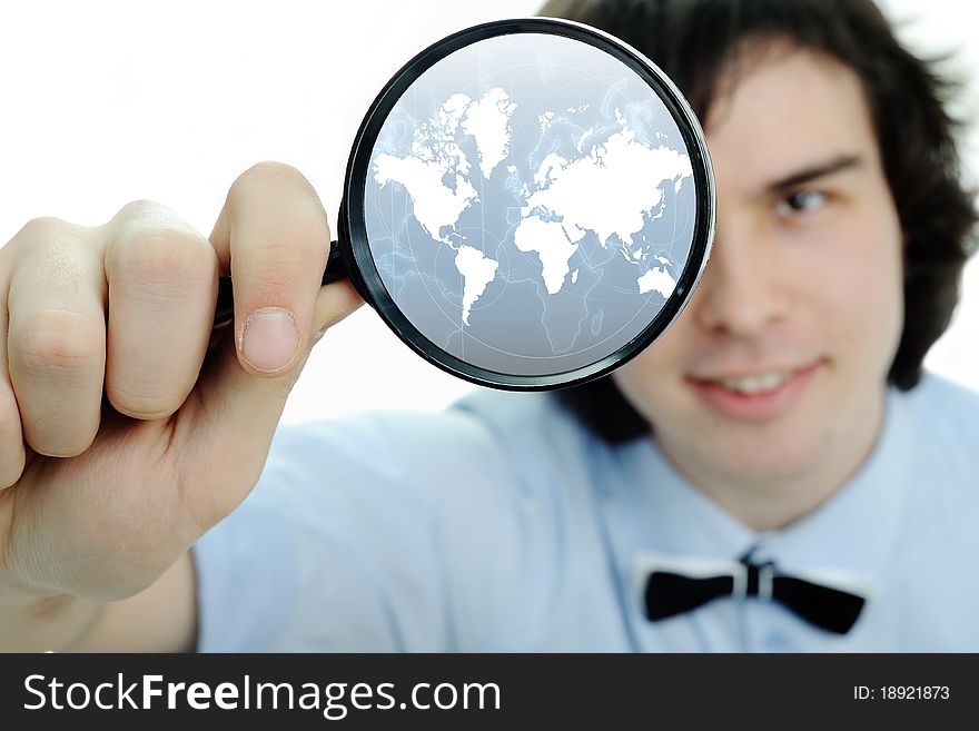 A young man with a magnifier with map in it