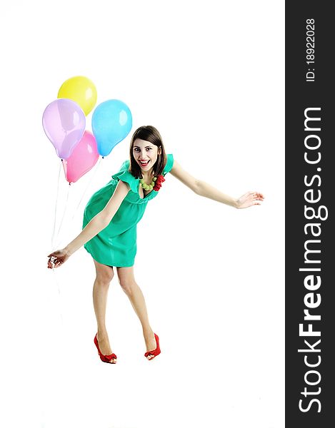 A young beautiful woman with bright balloons. A young beautiful woman with bright balloons
