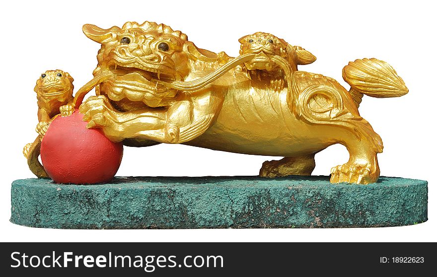 Golden lion statue form. The guard in a Chinese temple. Golden lion statue form. The guard in a Chinese temple