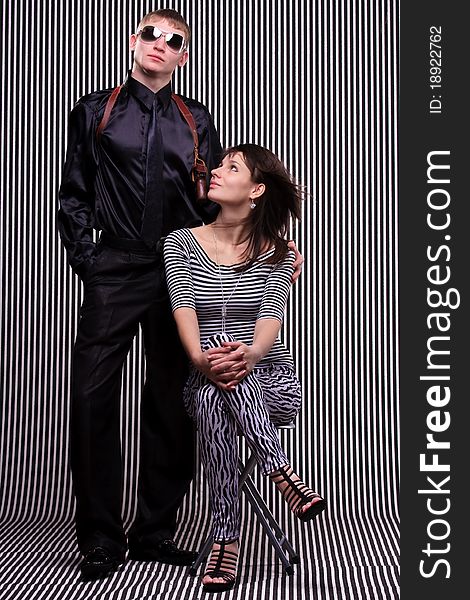 Young beautiful couple over stripe background. Young beautiful couple over stripe background