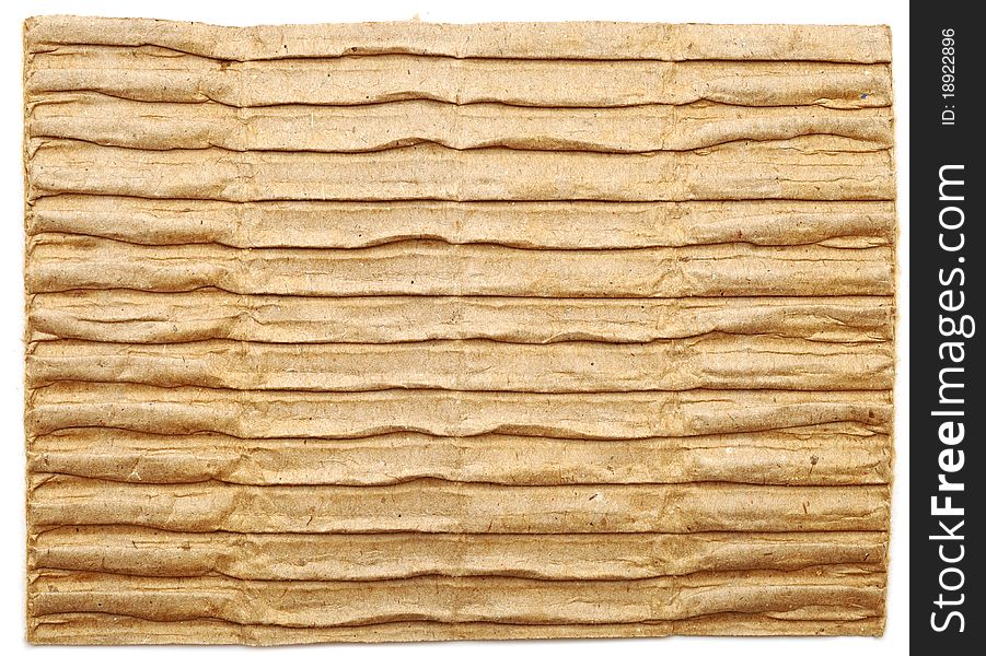 Textured cardboard with torn edges isolated on white