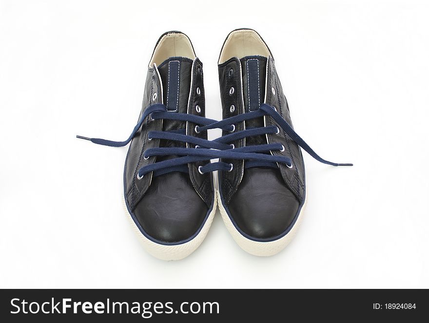 Sneakers laced a single cord