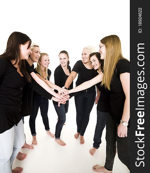 Team of Smiling Girls with clasped hands