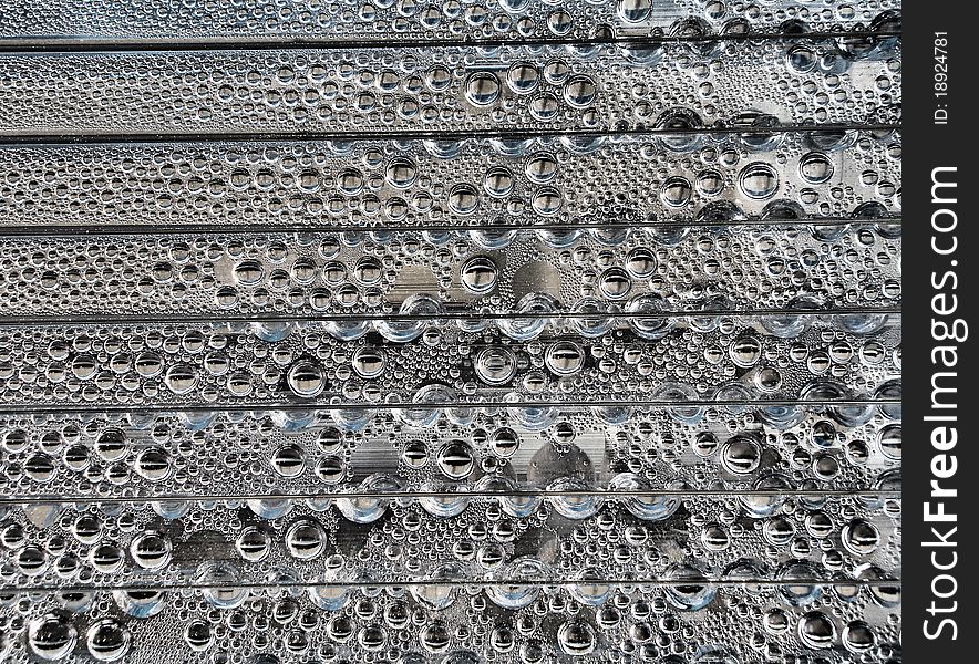 A lot of droplets on a swimming pool enclosure. A lot of droplets on a swimming pool enclosure