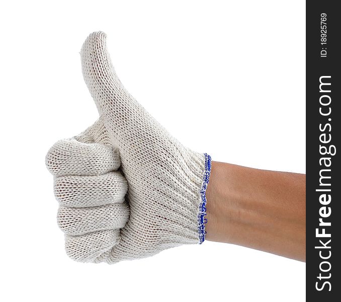 Hand with white fabric glove showing thumb up