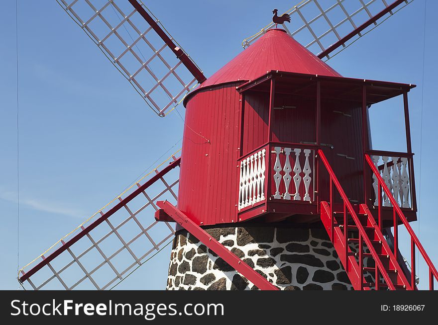 Red windmill in the coast of Pico island, Azores