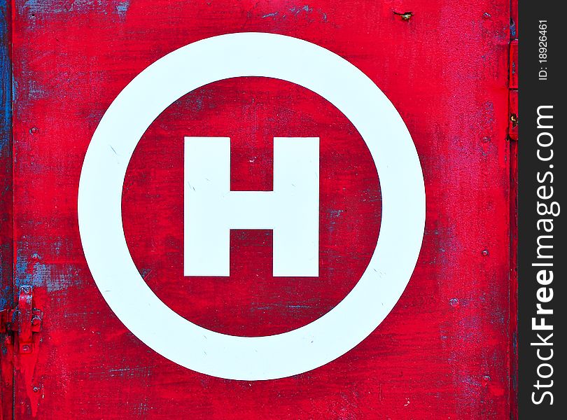 Red grunge background and white H as symbol for hydrant. Red grunge background and white H as symbol for hydrant