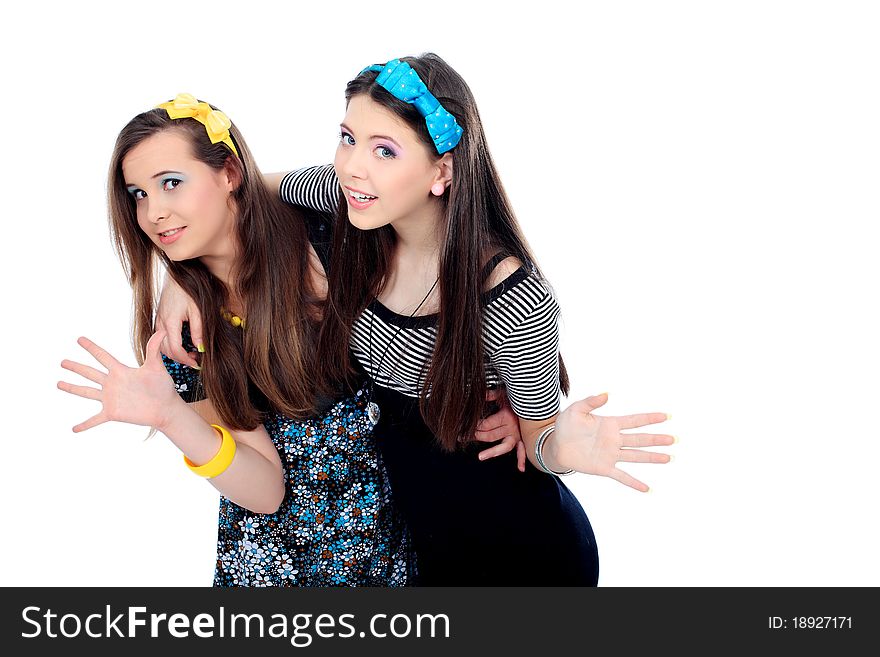 Two happy girls friends. Isolated over white background. Two happy girls friends. Isolated over white background.