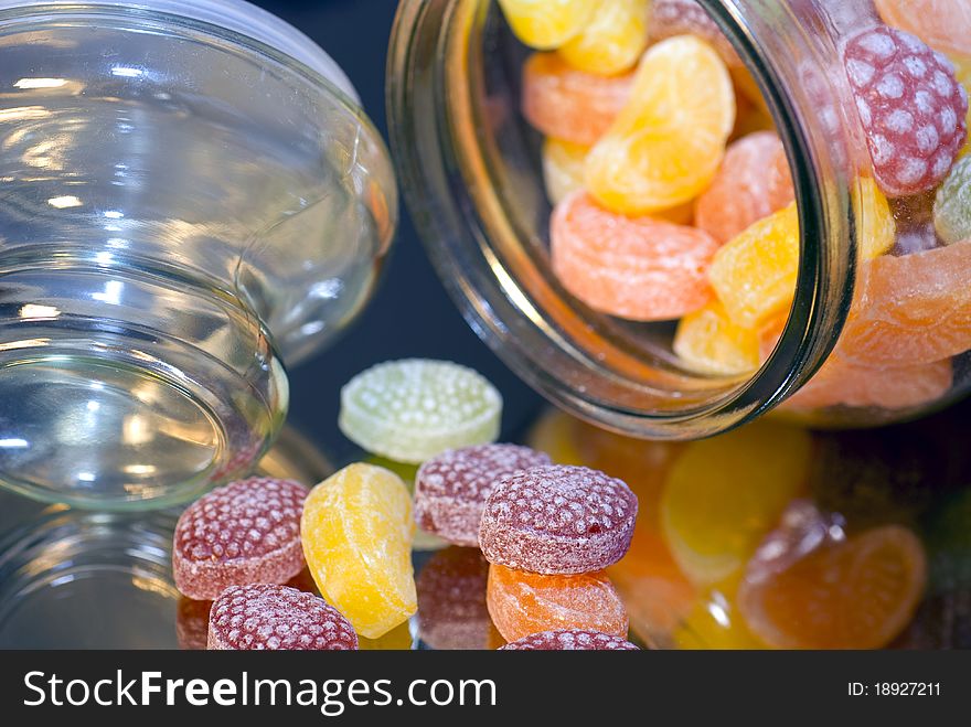 Close up of Colorful caramels in glass pot. Close up of Colorful caramels in glass pot