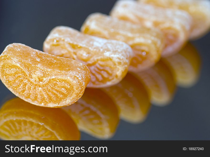 Close up of Colorful caramels with reflected background. Close up of Colorful caramels with reflected background