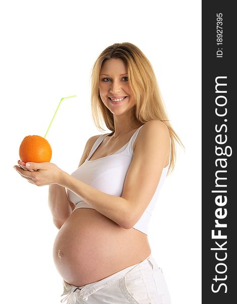 Pregnant woman holding orange with straw