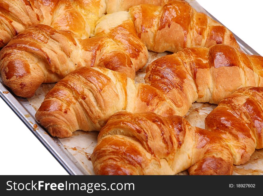 Appetizing croissants on a white background