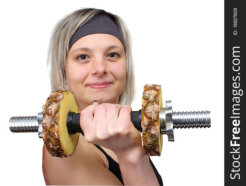 Woman playing sports with pineapple dumbbells