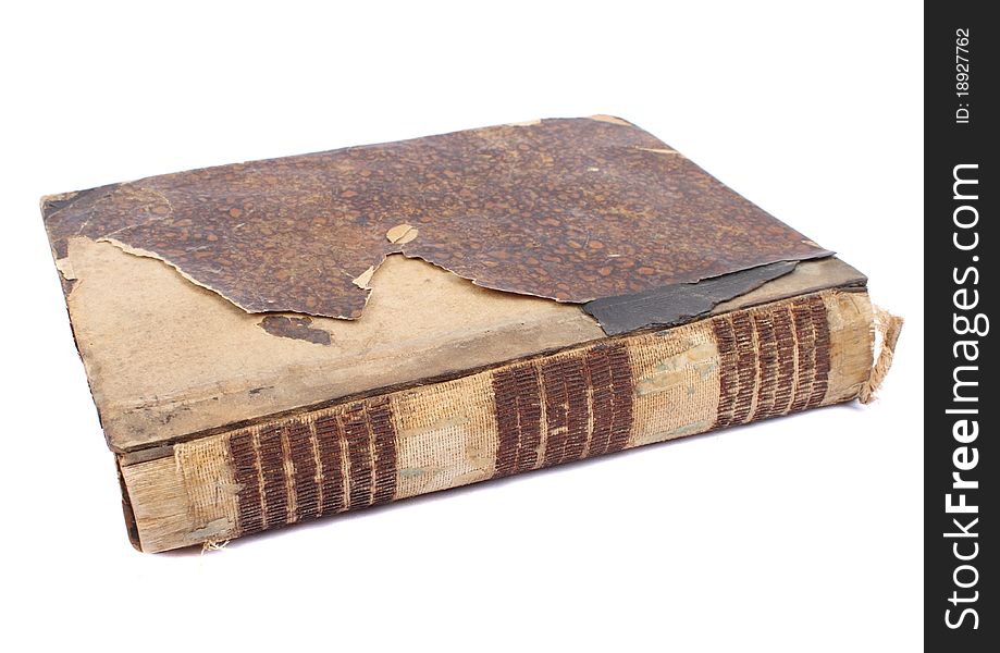 An old worn book with a ragged crust