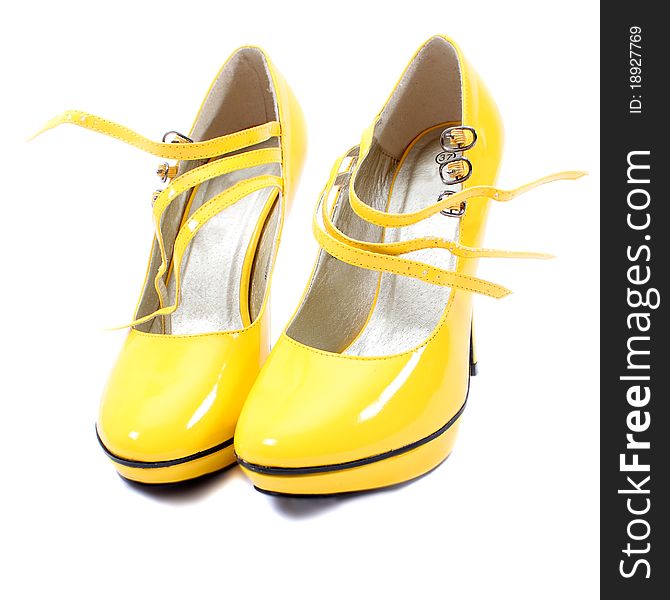 A pair of yellow woman's shoes. A pair of yellow woman's shoes