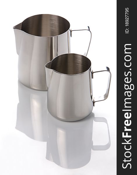 Two metal jugs