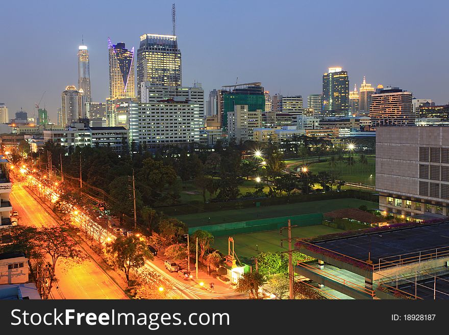 Bangkok cityscape skyscraper with light trail of freeway to the city. Bangkok cityscape skyscraper with light trail of freeway to the city