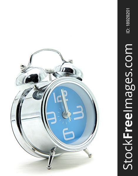 Isolated blue alarm clock on white side perspective