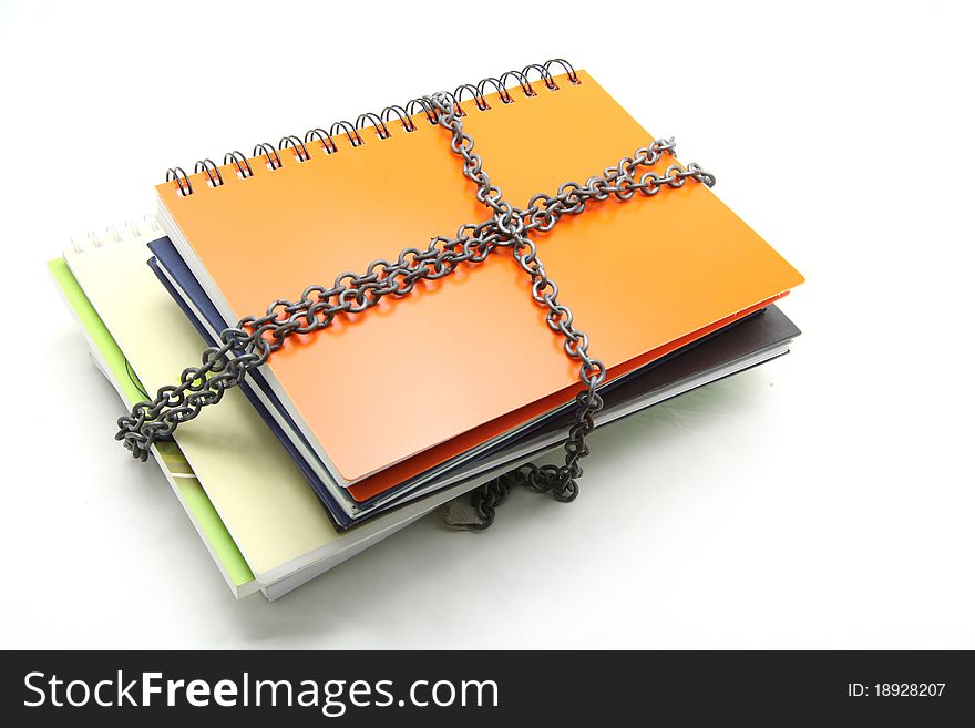 Stack of books with chain