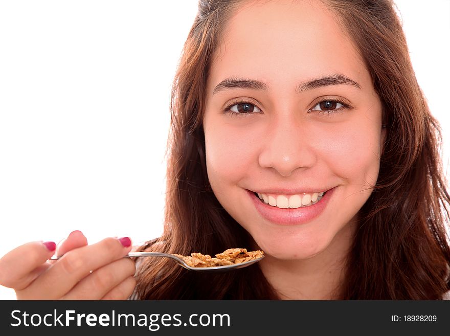 Happy women with a spoon in your hand with cereal. Happy women with a spoon in your hand with cereal