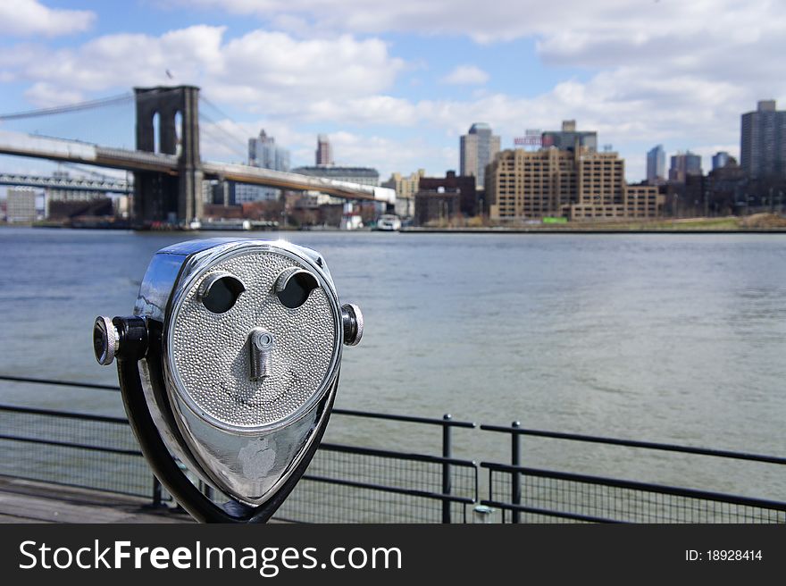 Viewer with happy face ready to scope Brooklyn from Manhattan side NYC. Viewer with happy face ready to scope Brooklyn from Manhattan side NYC