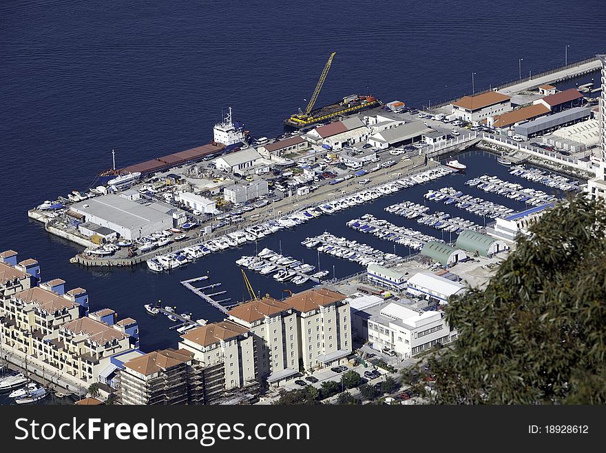 Aerial view of a marina with boats docked and harbor in Gibraltar. Aerial view of a marina with boats docked and harbor in Gibraltar