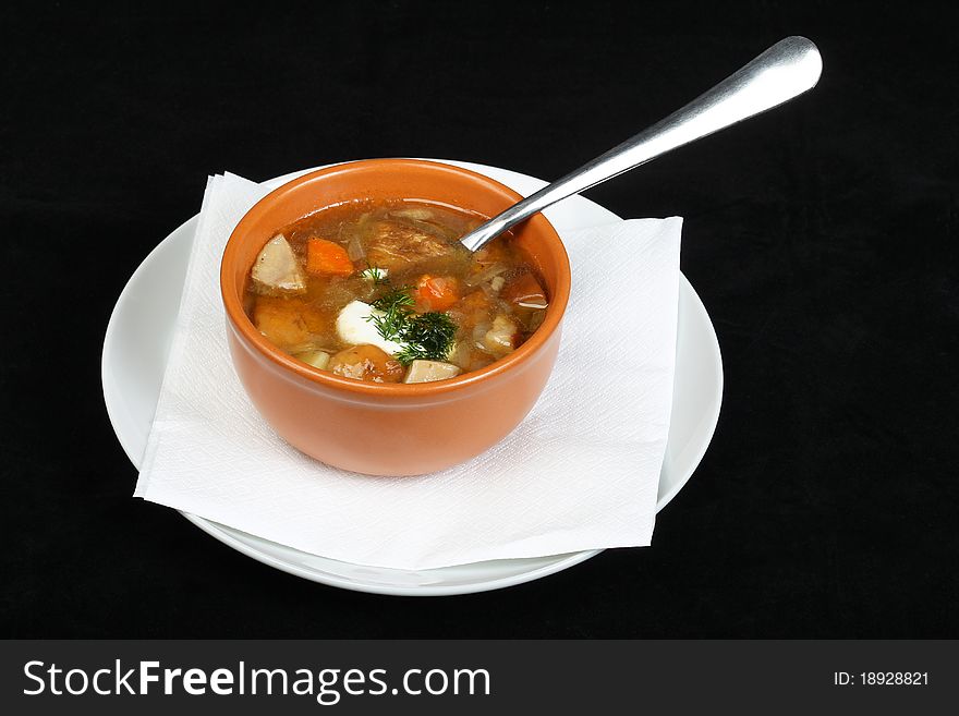 Mushroom soup at a black background