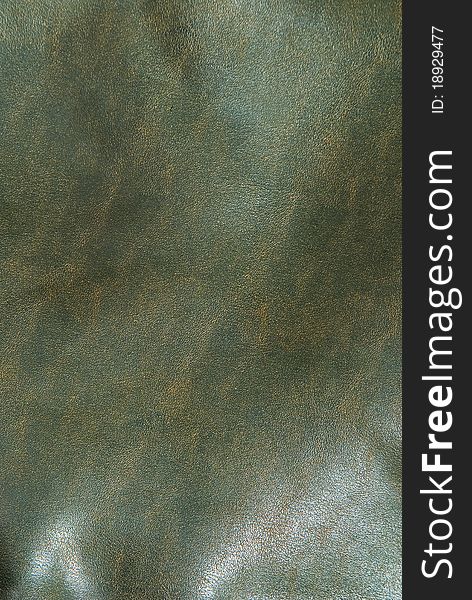Iny brown leather background close up. Iny brown leather background close up