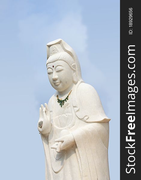 White of goddess of mercy (Kuan Yim) statue on coral island (Koh Larn). White of goddess of mercy (Kuan Yim) statue on coral island (Koh Larn).