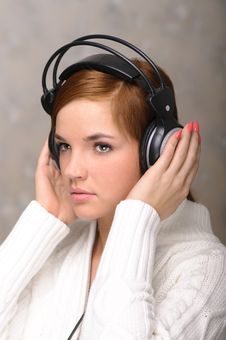 Young Woman Listening To Headphones Royalty Free Stock Photography