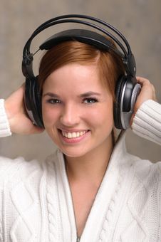Young Woman Listening To Headphones Royalty Free Stock Image