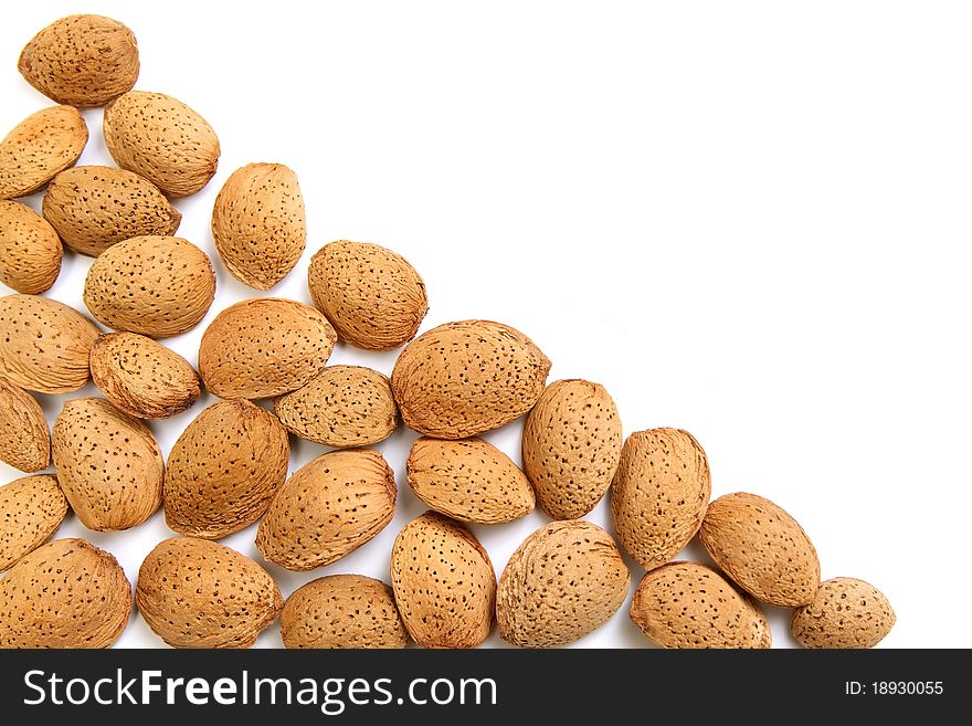 Tasty fresh almond nuts isolated on white background with empty space for your notes. Tasty fresh almond nuts isolated on white background with empty space for your notes