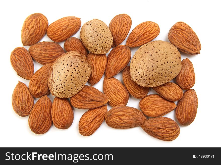 Heap of almond nuts isolated on white background. Heap of almond nuts isolated on white background