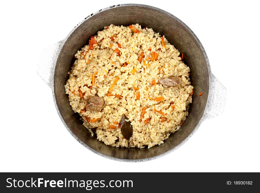 Pilaf in a cauldron isolated on a white background