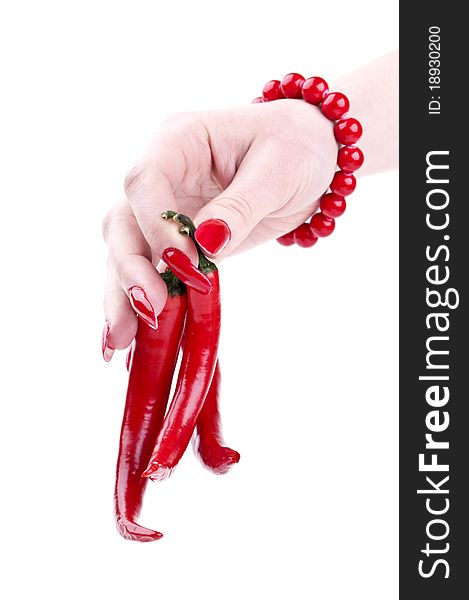 Red pepper in the hands of a girl isolated on a white background