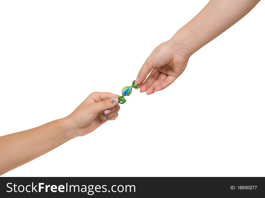 Two women hands with candy isolated on white background. Two women hands with candy isolated on white background