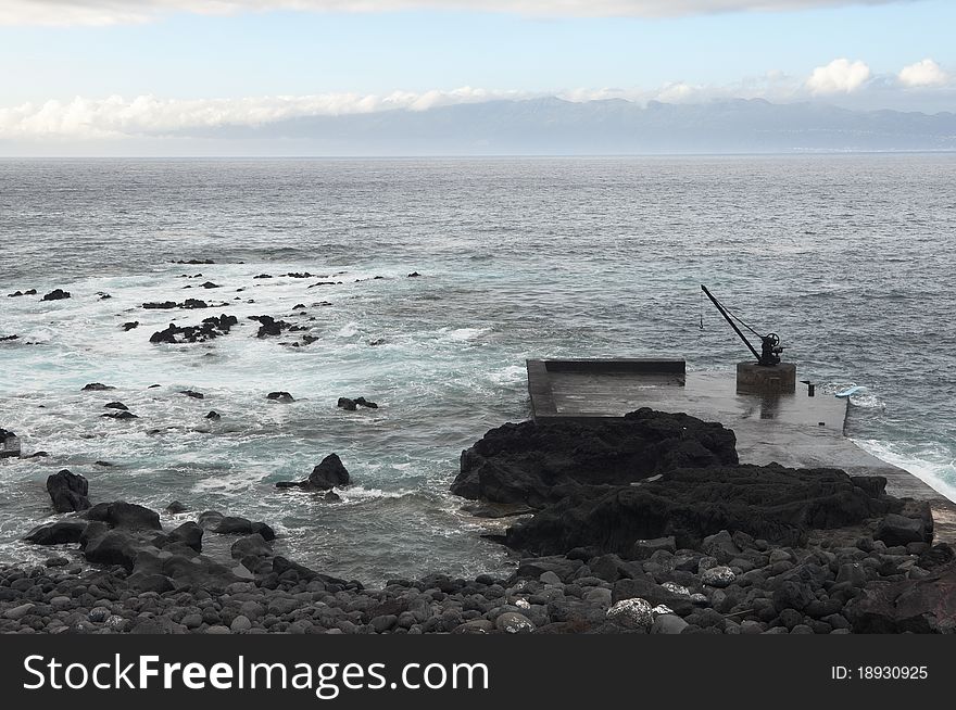 Small deserted quay in the coast of Pico island, Azores