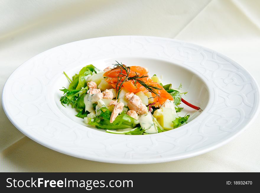 Salmon appetizer in plate with vegetable. Salmon appetizer in plate with vegetable.