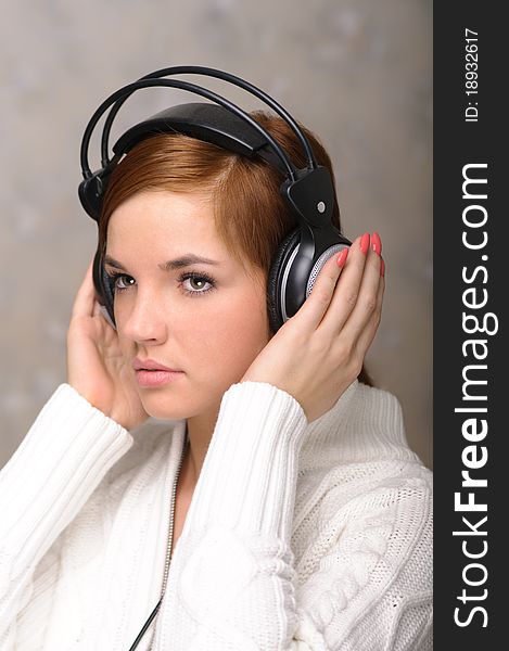 Young Woman Listening to Headphones