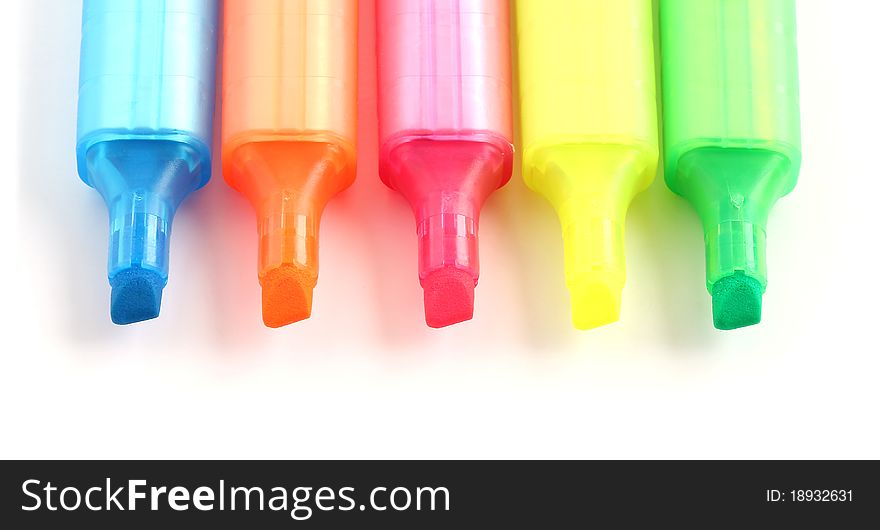 Highlighter marker pens in five different bright colors isolated on white background. Highlighter marker pens in five different bright colors isolated on white background