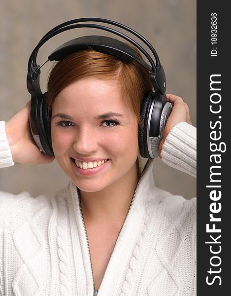 Beautiful young girl listens to her favorite tunes. Beautiful young girl listens to her favorite tunes