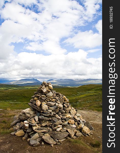 Stone pyramid and sky with clouds, Norway. Stone pyramid and sky with clouds, Norway