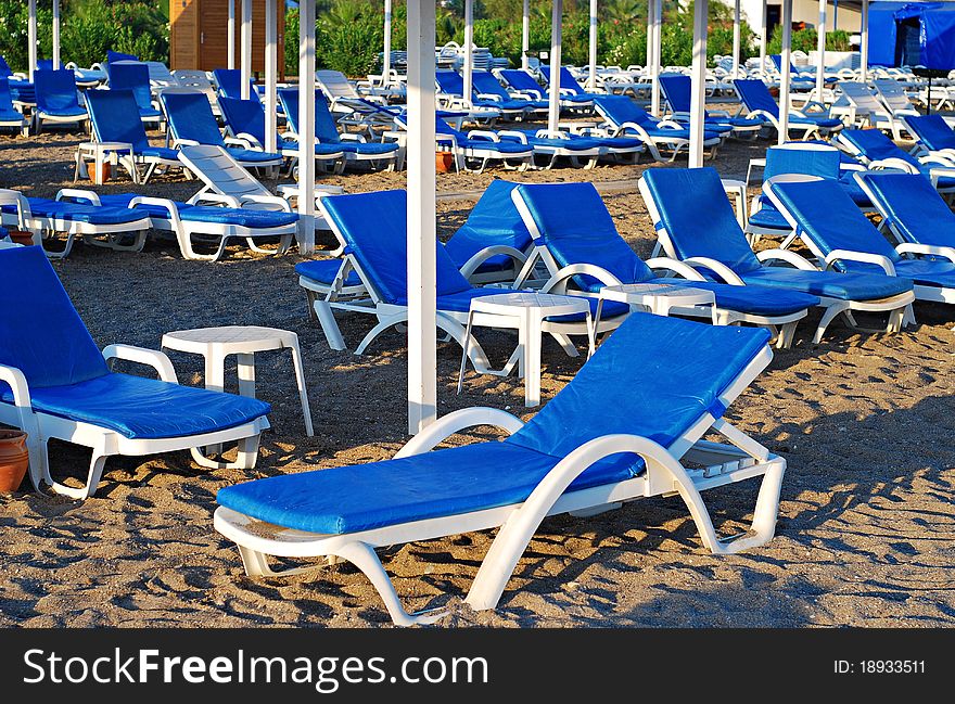 Beach with lot of chair without people. Travel background.