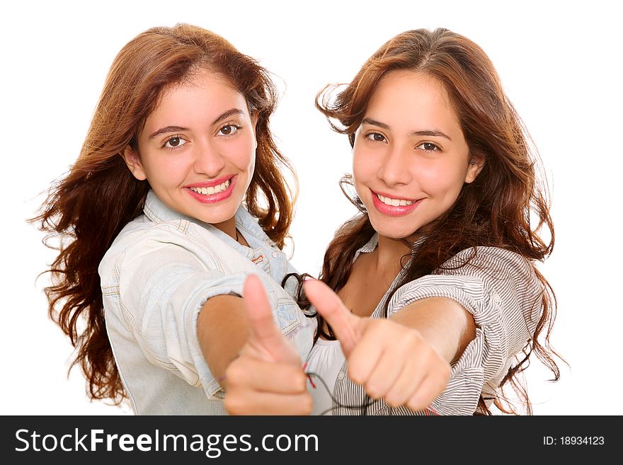 Two happy friends smiling at the camera with a gesture of ok on their hands