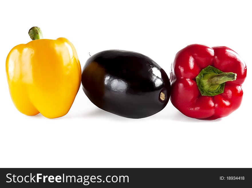Yellow, red pepper and eggplant isolated on white background