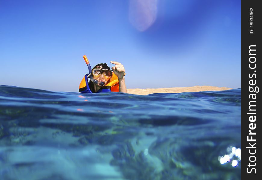 Woman in the sea swiming snorkel