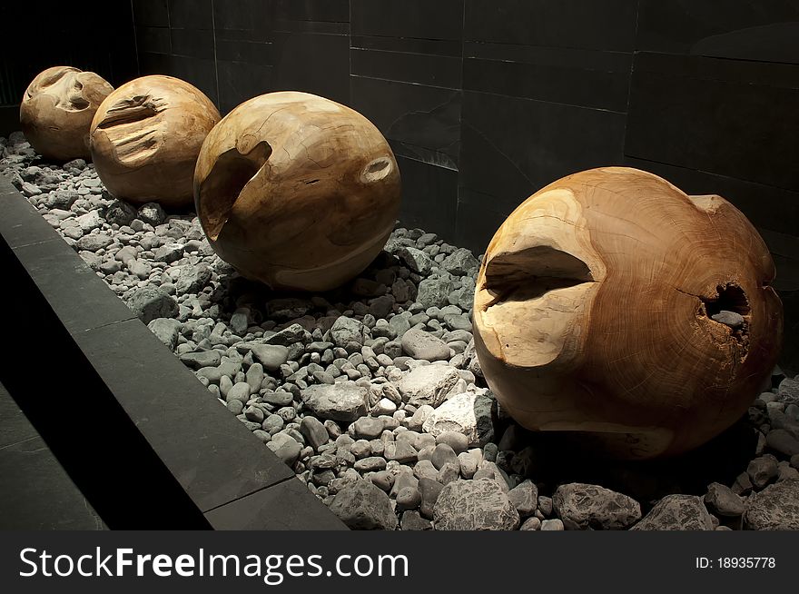 Wooden balls based on small river rocks