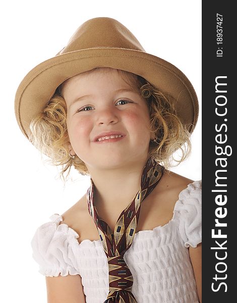 Close-up of an adorable preschooler in a sundress and her grandpa's wide tie and felt hat. Close-up of an adorable preschooler in a sundress and her grandpa's wide tie and felt hat.