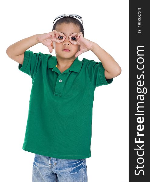 Boy making glasses symbol with his fingers, isolated on white background